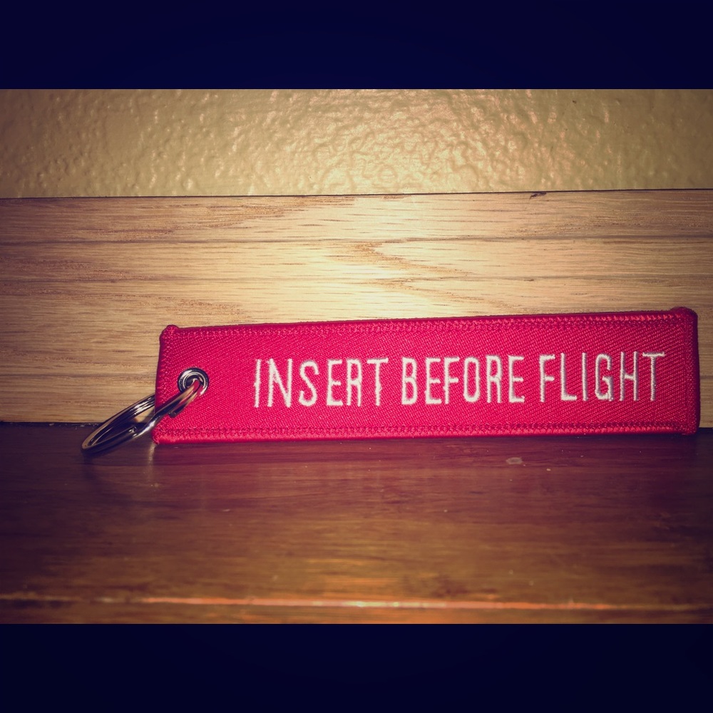 “INSERT BEFORE FLIGHT” Keychains